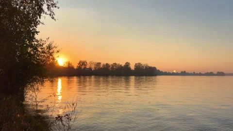 A solar eclipse during a mesmerizing fiery sunset. Majestic sunset or sunrise la Stock Footage 251653071