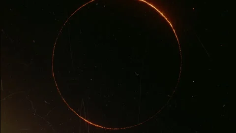 Solar eclipse forming ring of fire in dark sky Stock Footage 309093635