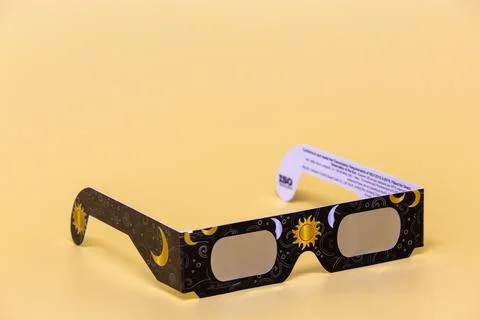 Solar eclipse glasses protecting eyes during astronomical event Stock Photos