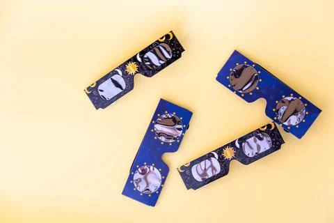 Solar eclipse glasses protecting eyes during celestial event Stock Photos