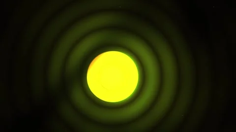 Solar eclipse with green concentric circles on black background. Stock Footage 335540243