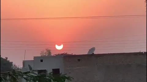 Solar eclipse in Khanewal, Pakistan Stock Footage 220444438