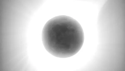 Solar Eclipse. The moon moving in front of the sun Fotos Stock