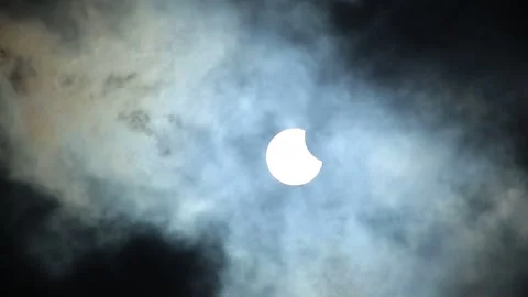 Solar eclipse with moving clouds on June 10th 2021 Stock Footage 155552189