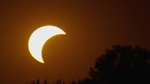Solar eclipse observed with phases captured in four frames in a clear sky Stock Footage 342176925