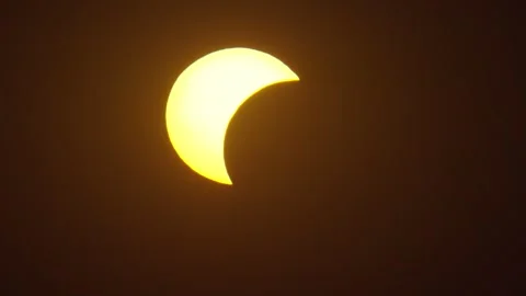 Solar eclipse observed in several stages from a specific location on a clear day Stock Footage 342176292