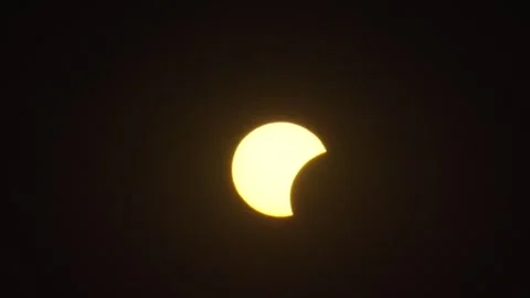 Solar eclipse observed at various stages in a clear sky with no clouds Stock Footage 342174857