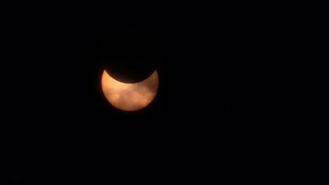 Solar eclipse occurs over the Midtown Manhattan skyscrape in New York City Stock Footage 277873828