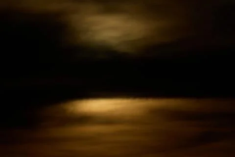 Solar eclipse over the landscape, showing dark lunar silhouette gliding acros Foto stock