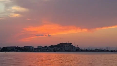 Solar Eclipse Sky Sunset Timelapse Over Denia Castle and Port Stock Footage 344575033