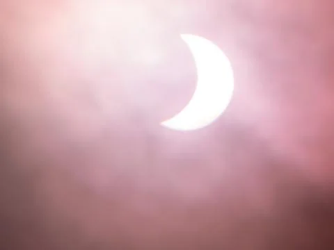 Solar eclipse, soft artistic background. White and dusky pinks. Stock-Fotos