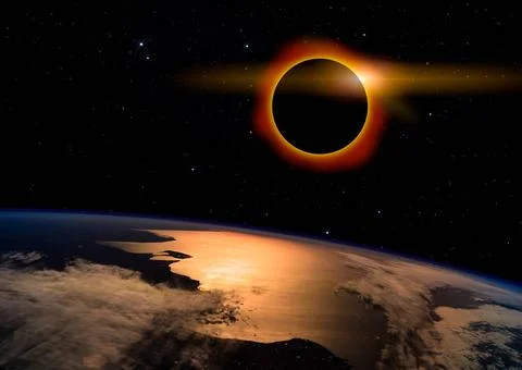 Solar Eclipse on Starry Sky Solar eclipse with orange halo over the planet... Stock Photos