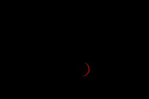 Solar eclipse sun crescent over Lleida, Spain Stock Photos