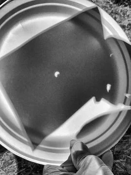 Solar Eclipse. The sun shadow reflected on a plastic dish Fotos de archivo