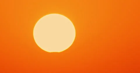 Solar eclipse sunset sky background timelapse, partial big sun time lapse nature Stock Footage 253129612