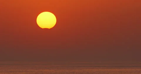 Solar eclipse sunset sky, partial eclipsed sun setting, beautiful ocean nature Stock Footage 253458817