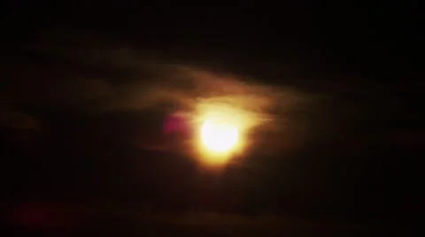 Solar Eclipse Sunset through clouds Video stock 43880759