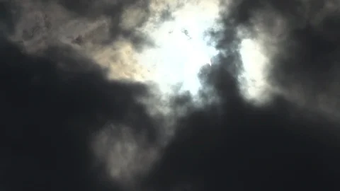 Solar Eclipse through Clouds Video stock 99431629