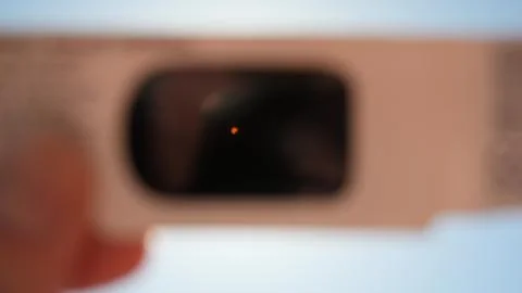 Solar Eclipse Through Solar Glasses Stock Photos