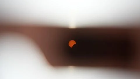 Solar Eclipse Through Solar Glasses Foto stock