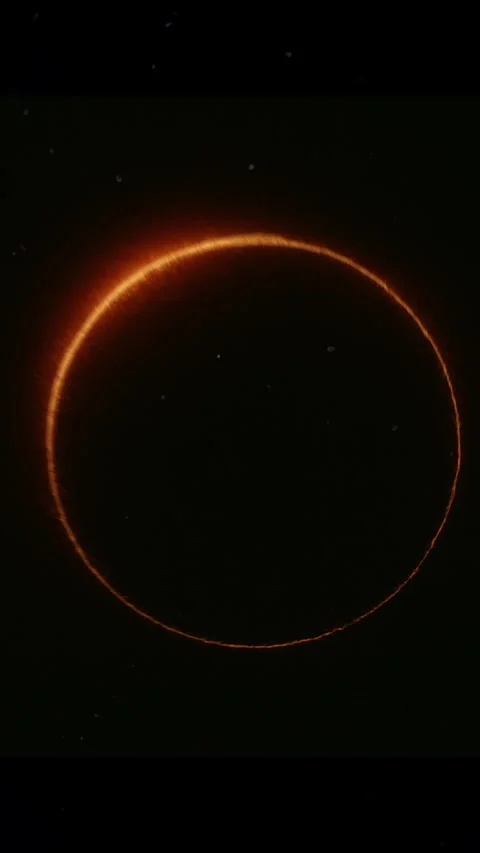 Solar eclipse transitioning on black background with film burn effect Stock Footage 310873974