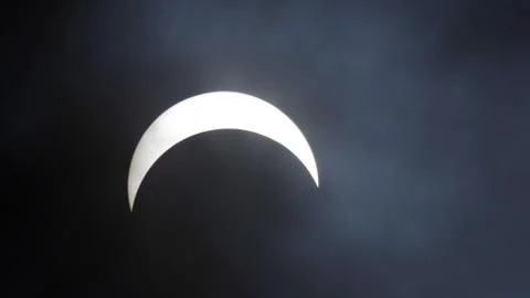 Solar eclipse under cloud cover Stock Photos