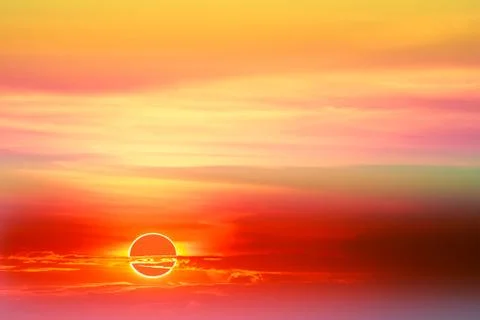 Solar eclipses occur in the sky while the sunset 写真素材