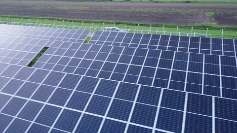 Solar Elevation: Aerial Drone Soaring Above Vibrant Solar Panel Landscape 스톡 동영상 255525147