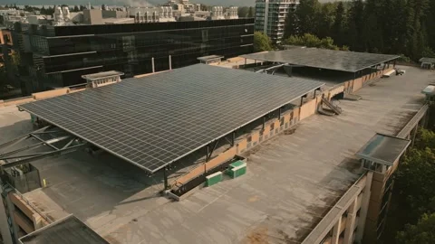 Solar energy array generating clean power on university parkade roof captured Stock-Footage 336033137