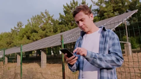 Solar energy engineer calculating efficiency and optimizing solar panel performa Stock Footage 300250111