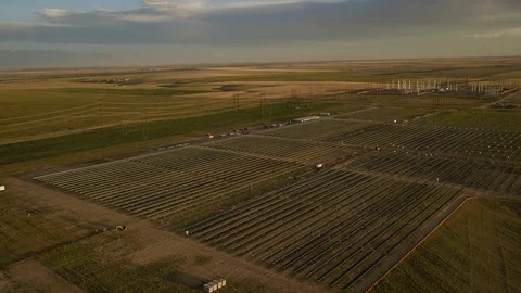 SOLAR ENERGY PANEL FIELD DJI INSPIRE DRONE AERIAL LONG SPIN WITH SUN FLARES Video stock 111497028