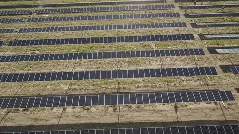 SOLAR ENERGY PANEL FIELD DJI INSPIRE DRONE AERIAL PAN SUN REFLECTIONS ON PANE Video stock 111497610
