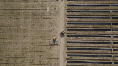 SOLAR ENERGY PANEL FIELD DJI CONSTRUCTION WORKERS INSTALLING PANEL Video stock 111608853