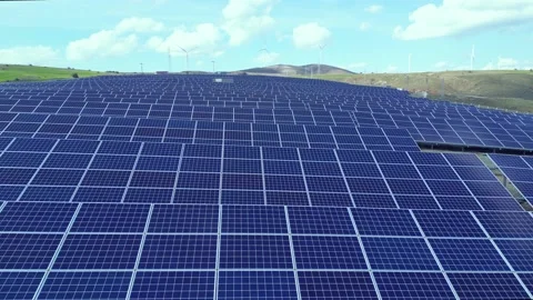 Solar energy panels and wind turbine. Drone view Video stock 238031311