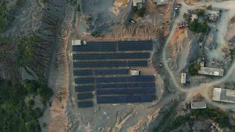 Solar energy panels powering a massive open pit gravel mining operation Stock Footage 341948330