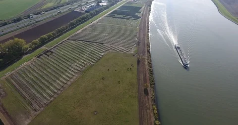 Solar energy Park in construction, river and boat aerial view, Netherlands Video stock 101038032