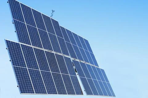 Solar energy-saving panels on the background of a blue sky Stock Photos