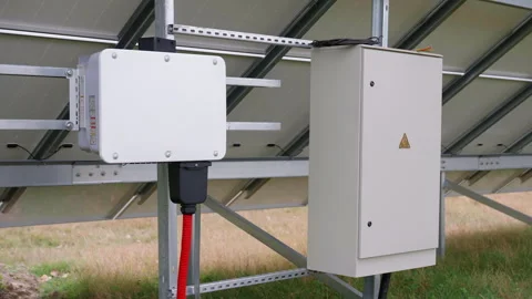 Solar energy system components, showcasing inverter and electrical box connected Stock Footage 318710321