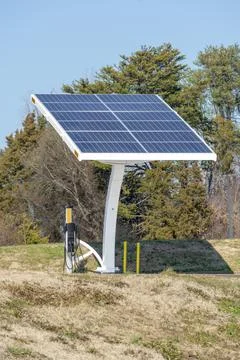 Solar Engery Panel Array Connected To Electrical Vehical Charging Station Stock Photos