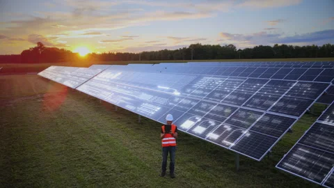 Solar Engineer Analyzing Photovoltaic Performance and Energy Optimization Stock Footage 336680763