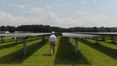 Solar engineer inspects energy panels Stock Footage 129765325