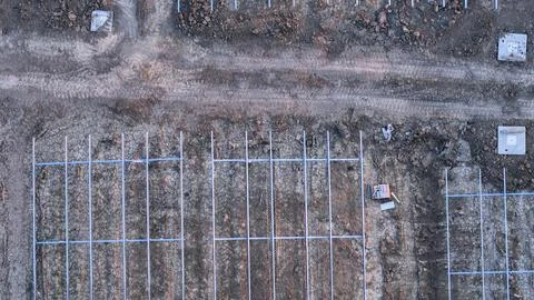Solar farm construction site featuring metal frameworks for future panels, .. Stock Photos