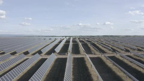 Solar farm: parallel rows solar panels, sun, shadows (ungraded, log gamma) Stock Footage 153929364