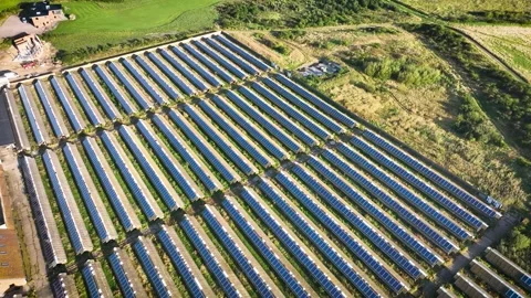 Solar farm with rows of solar panels installed on the roofs of sheds. 스톡 동영상 285593241