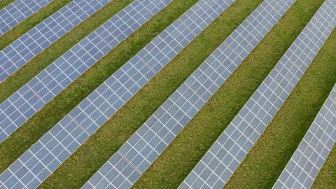 A solar farm, with thousands of Solar Panels capturing the sun's natural light Stock Footage 123920007