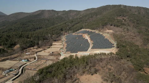 Solar Farm units environment producing renewable energy Aerial View, South Korea Stock Footage 229907484
