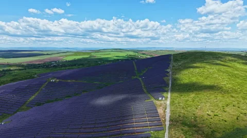 Solar farms spread on meadows. Deployment of renewable power systems across Stock Footage 337888040