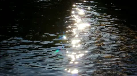 Solar flares on current water Stock Footage 22037736