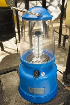 A solar lantern powered by a solar panel, part of a display to promote renewa Stock Photos