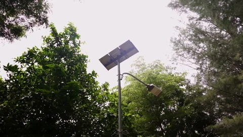 Solar light in the tropical park. Alternative energy from the sun. Stock Footage 248098074